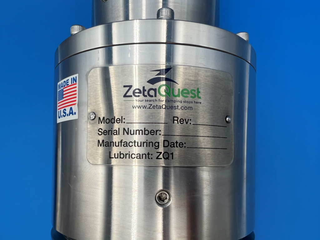 Metal nameplate affixed to mechanical device