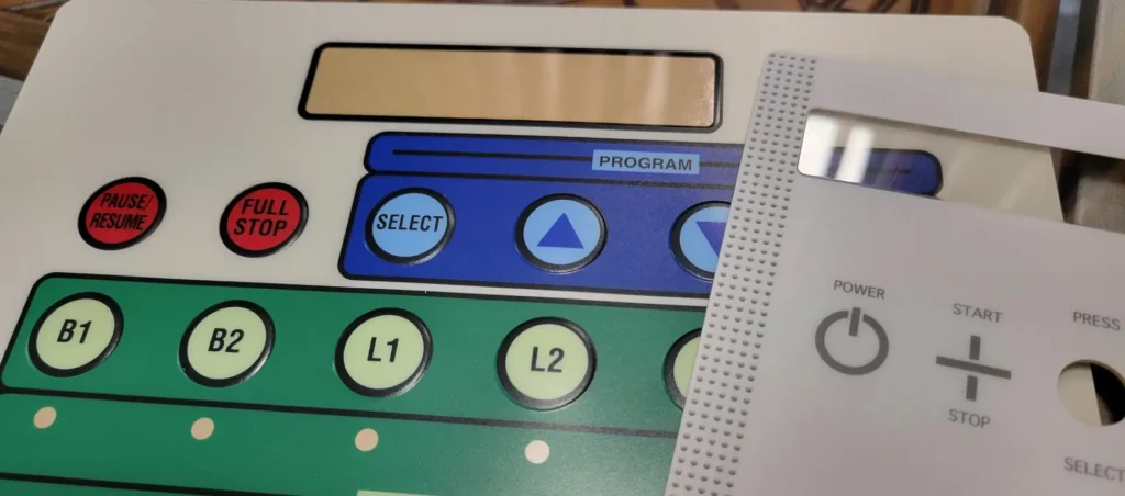 Embossed buttons on an overlay