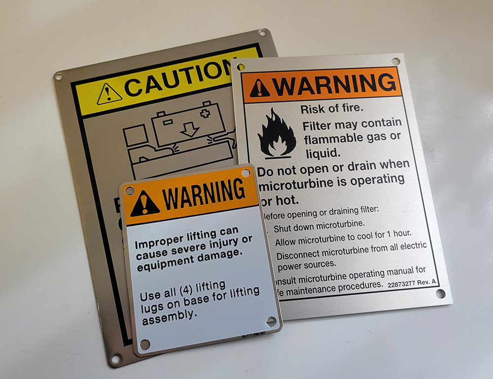 Metal warning tags Durable metal warning tags used on industrial equipment